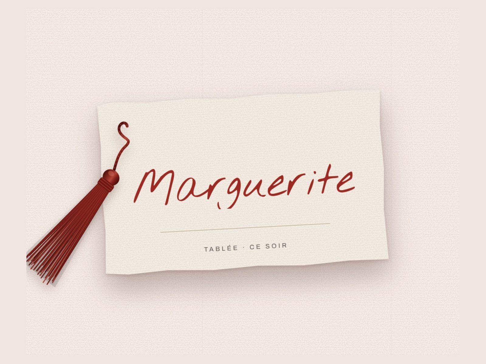 Tablée place card with a red silk tassel